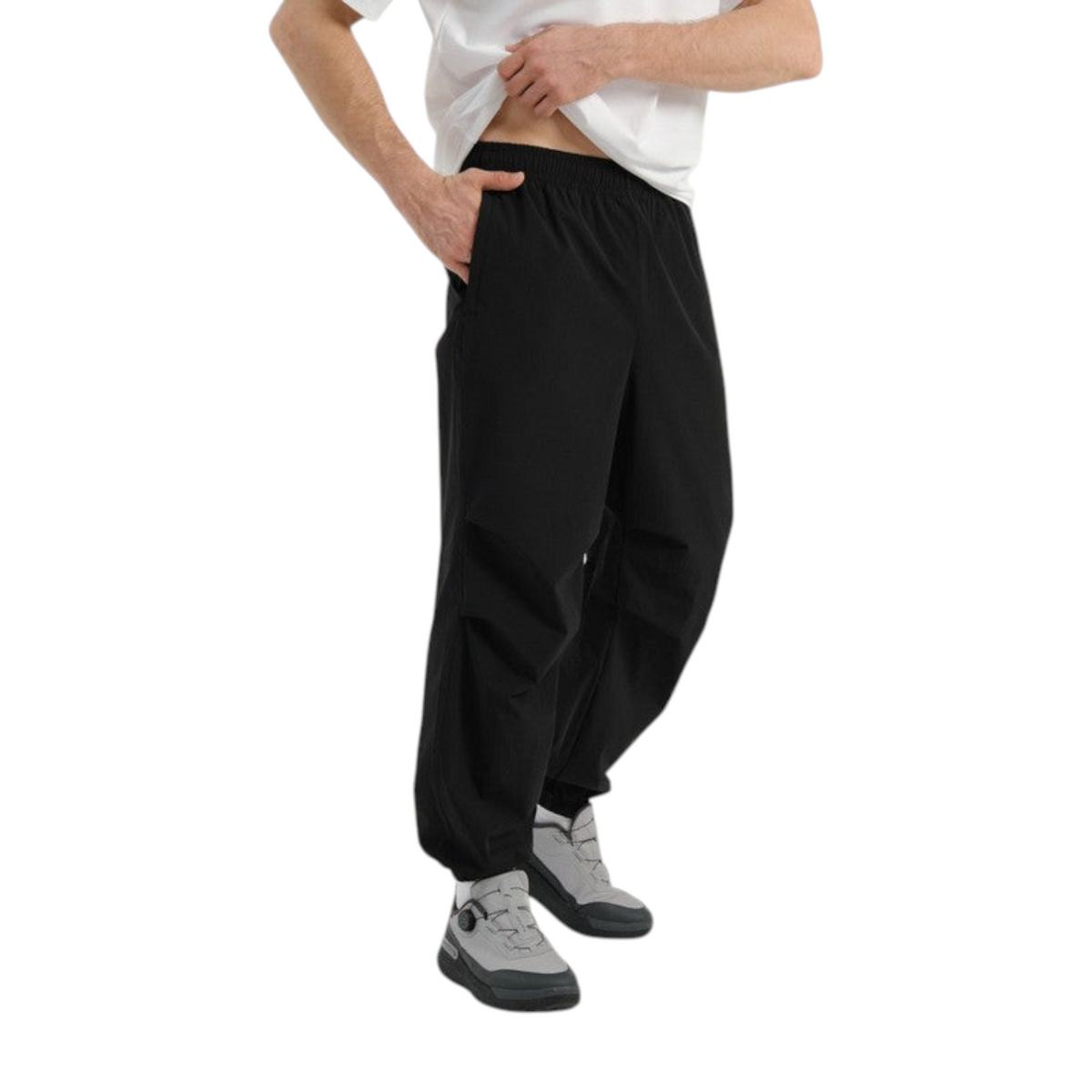 FRG COMMUTE relaxed black woven trousers with an elasticated waistband worn by a man in a white t-shirt