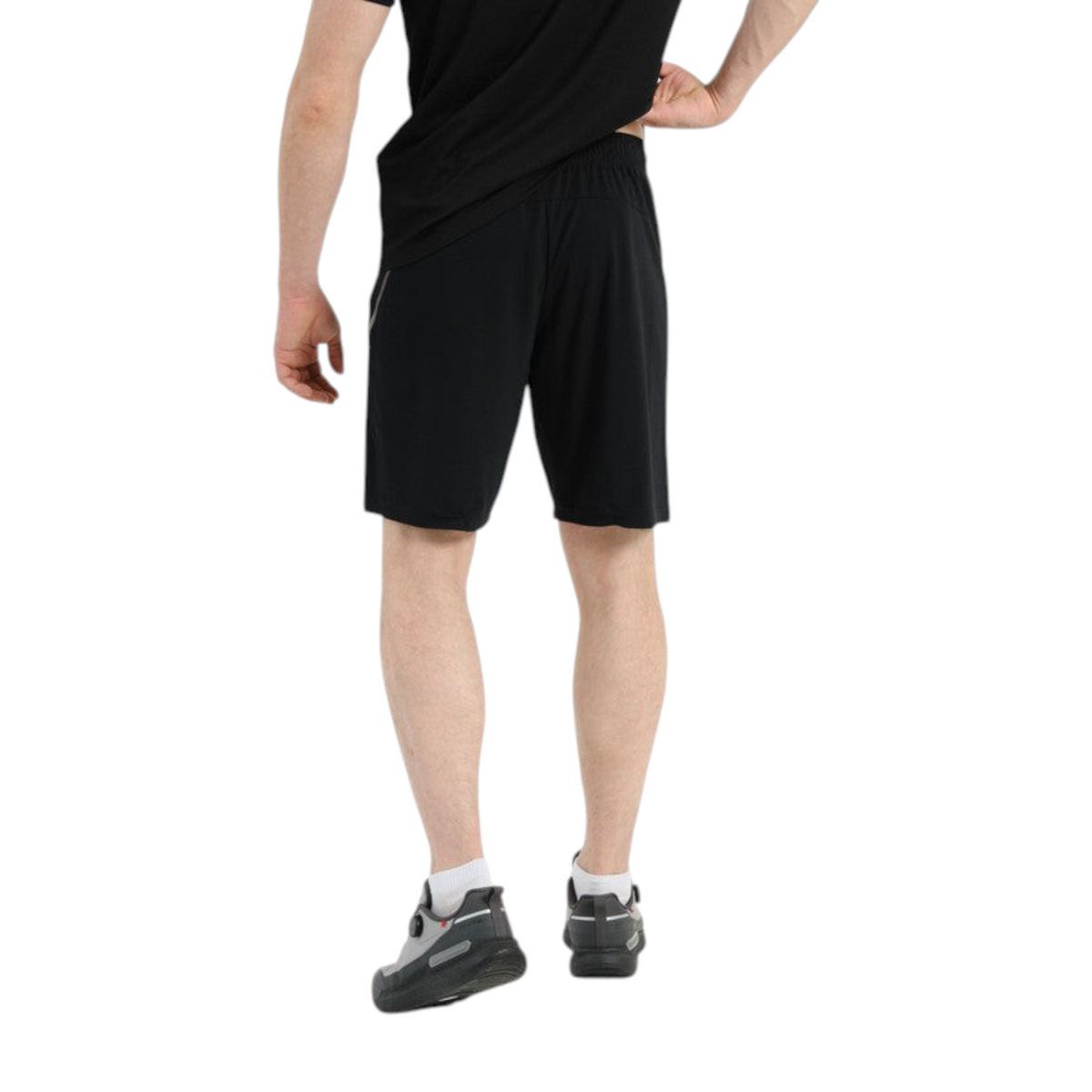Back view of a man wearing FRG Anta Knit Half Pants TRN in black, featuring a regular fit for functional training.