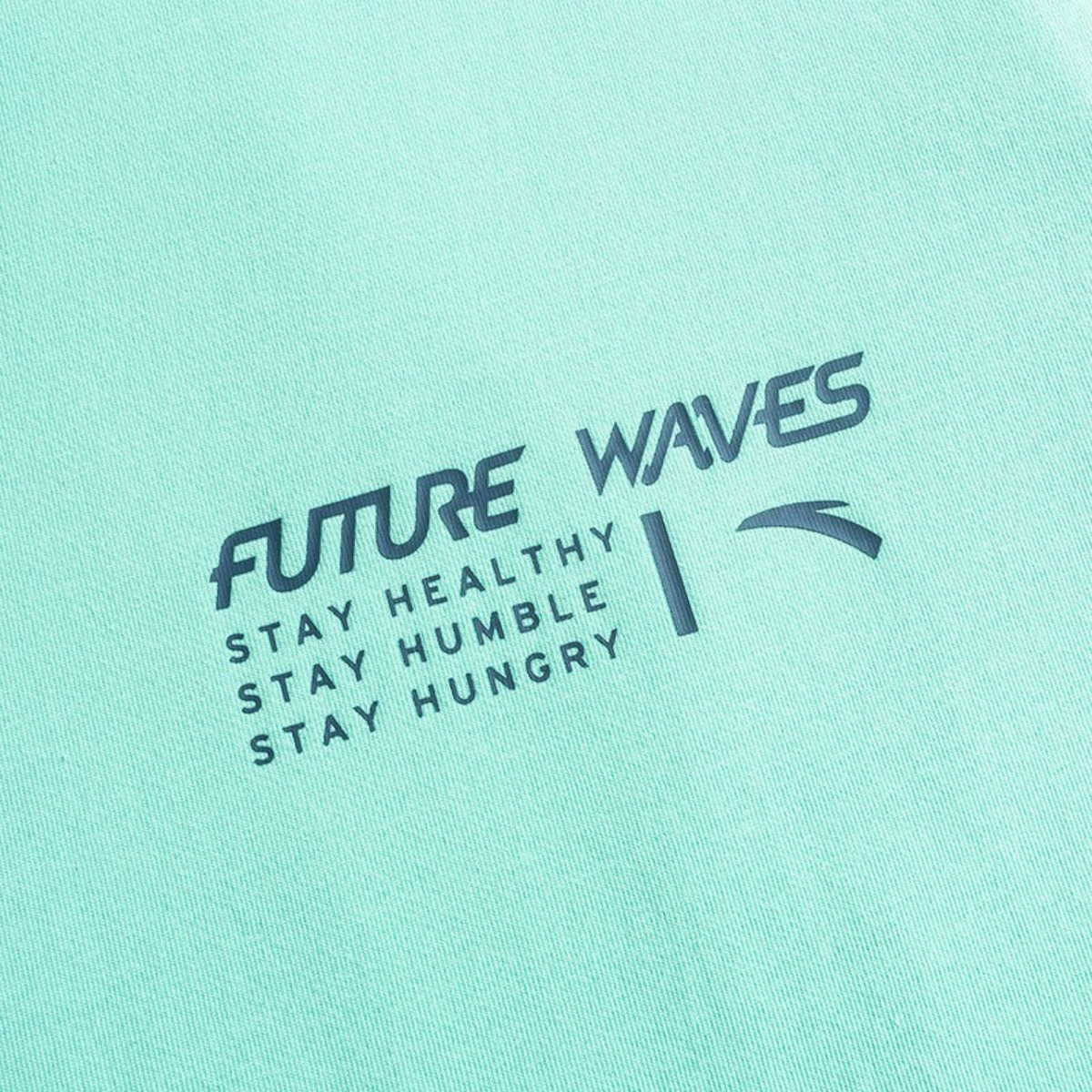 FRG SS TEE in mint green featuring Future Waves graphic print with motivational text in dark blue ink