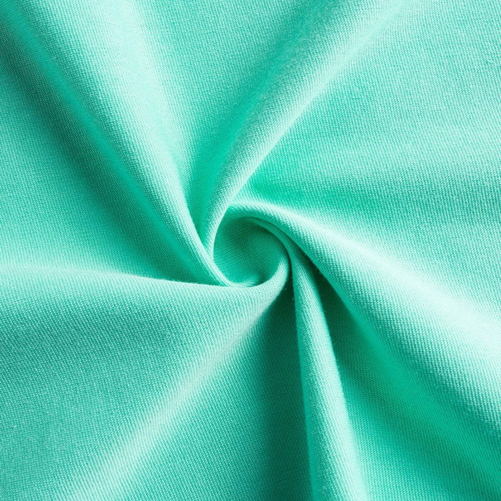 Close-up of mint green cotton fabric from a FRG SS TEE showing the soft texture and weave.