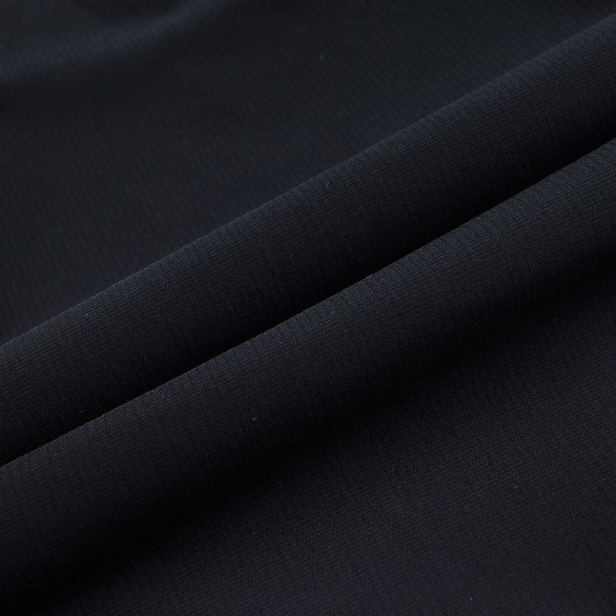 FRG ANTA Splash Express black knit track pants fabric detail showing smooth texture and four-way stretch material