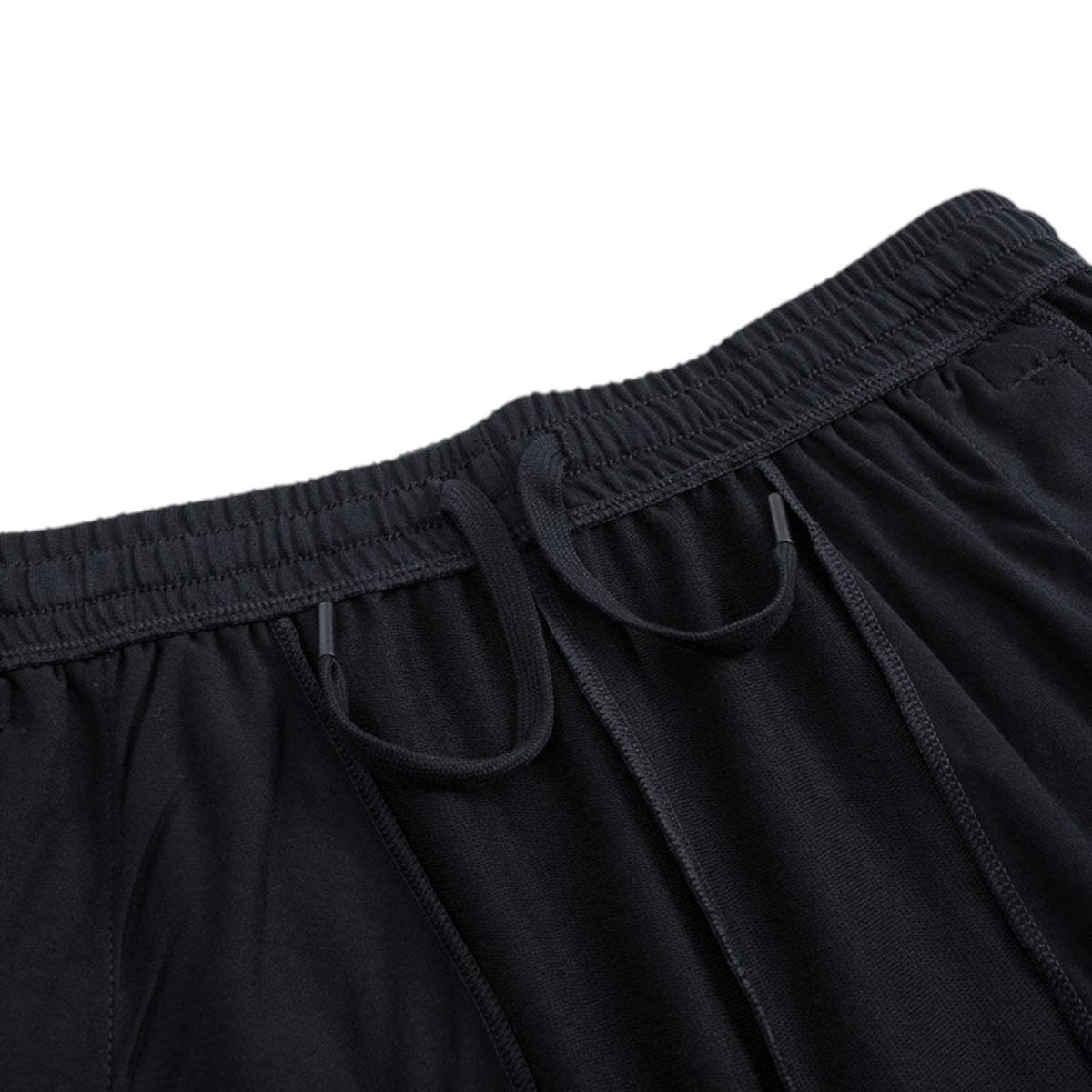 FRG black knit half pants featuring an elasticated waistband with adjustable drawstring cords.
