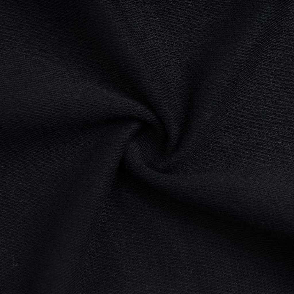 Close-up of black knit fabric texture for FRG KNIT HALF PANTS showing the soft, breathable material weave.