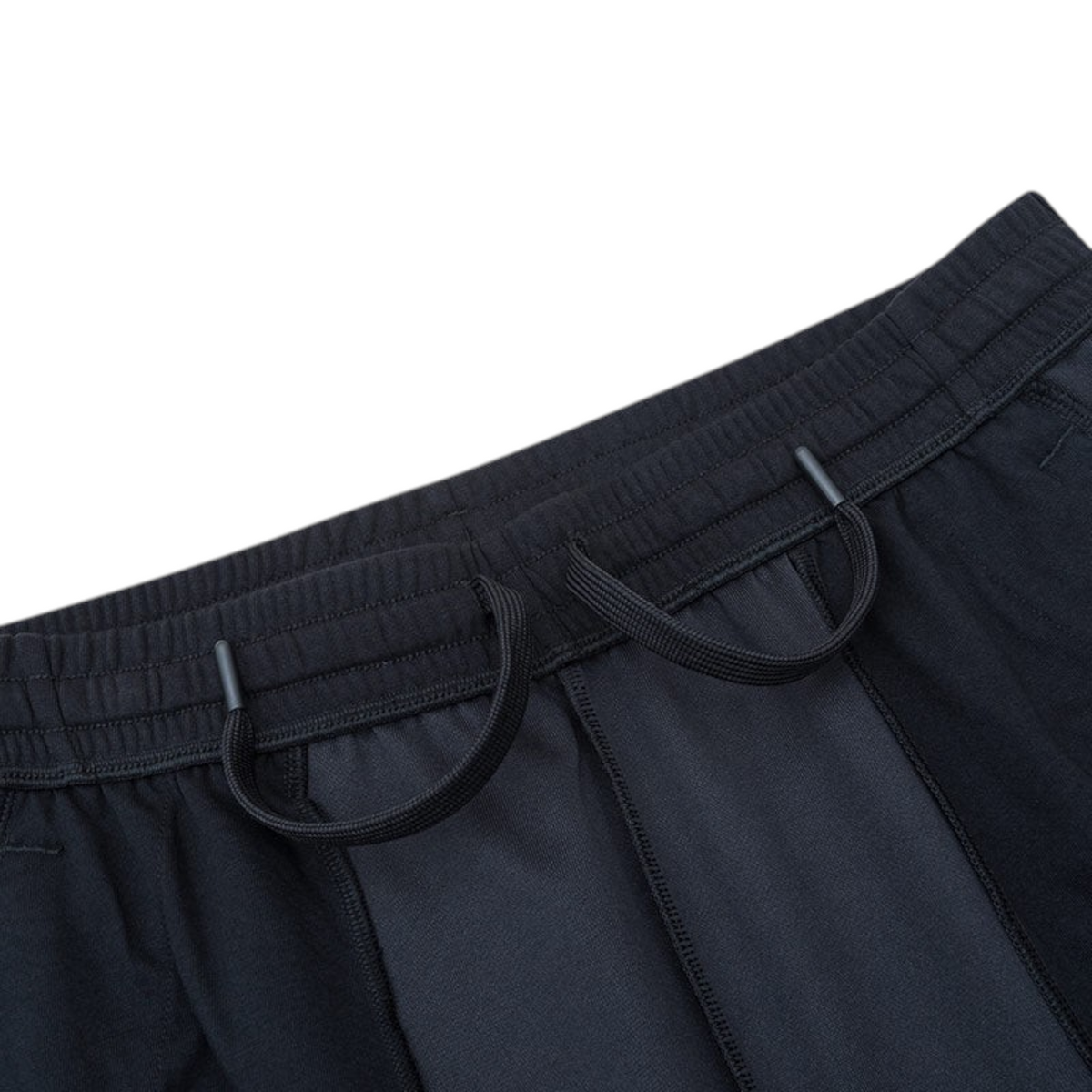 FRG ANTA black knit track pants featuring an elastic waistband with adjustable drawstrings and soft fabric texture.