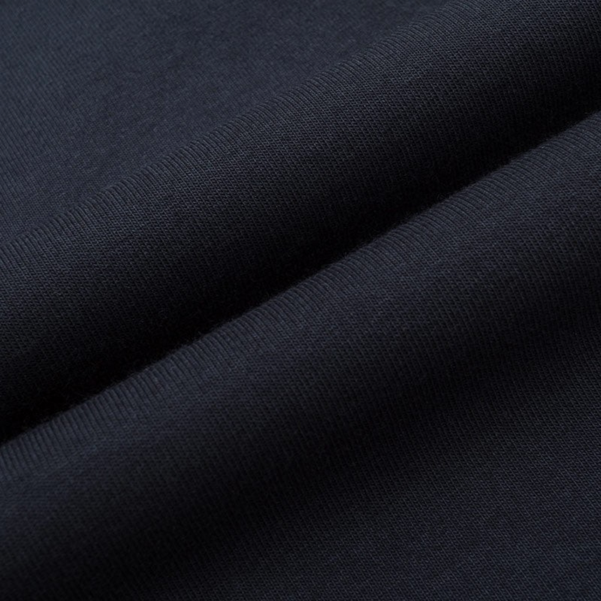FRG ANTA black knit track pants fabric detail showing soft polyester cotton blend texture