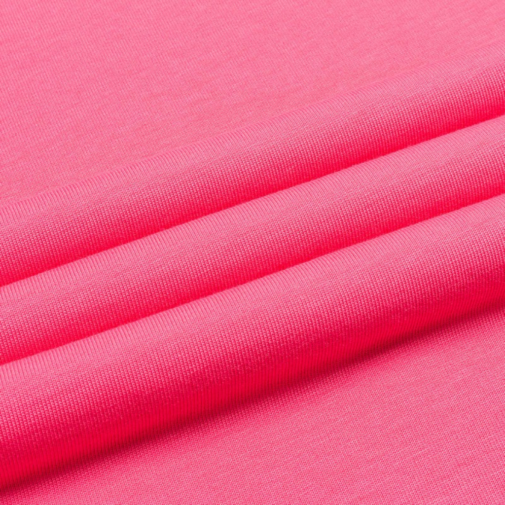 Close-up of FRG SS TEE fabric in a vibrant hot pink colour showing the soft cotton texture and folds.
