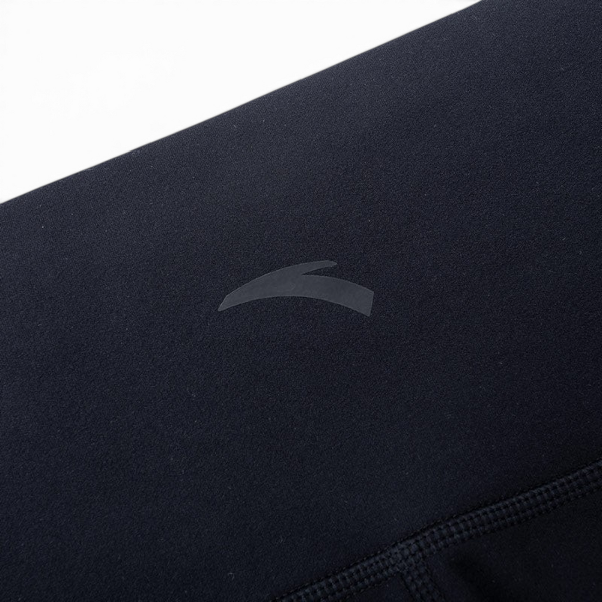 FRG ANTA black cross training tight ankle pants featuring a subtle logo detail on soft polyester elastane fabric