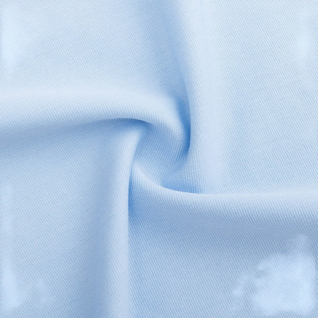 Close-up of light blue fabric texture for FRG SS TEE showing soft cotton weave