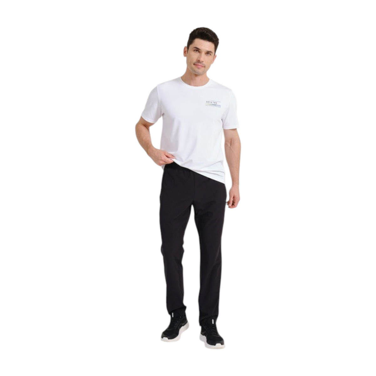 FRG model wearing black ANTA woven track pants with an elastic waistband and a white t-shirt for athletic training.