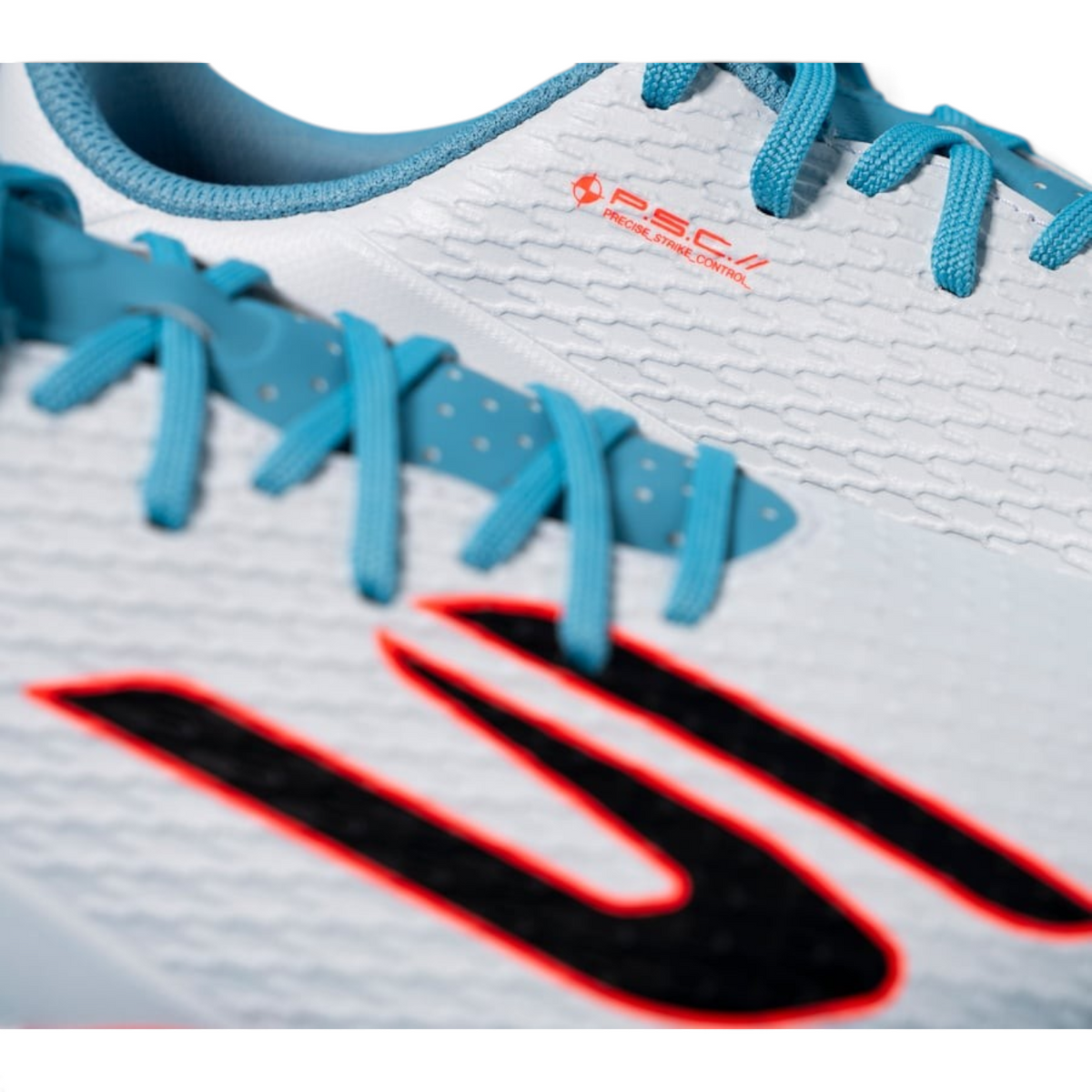FRG Skechers Club TF turf boot in white with turquoise laces and pink detailing, featuring a textured upper.