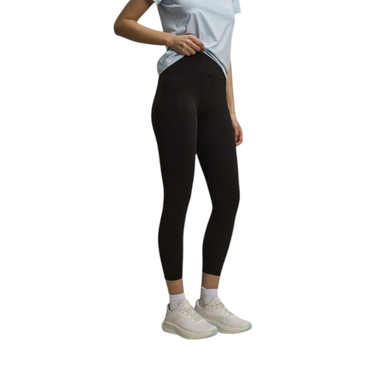 FRG Anta Pro women's black cropped training leggings with side pocket, worn with white sneakers