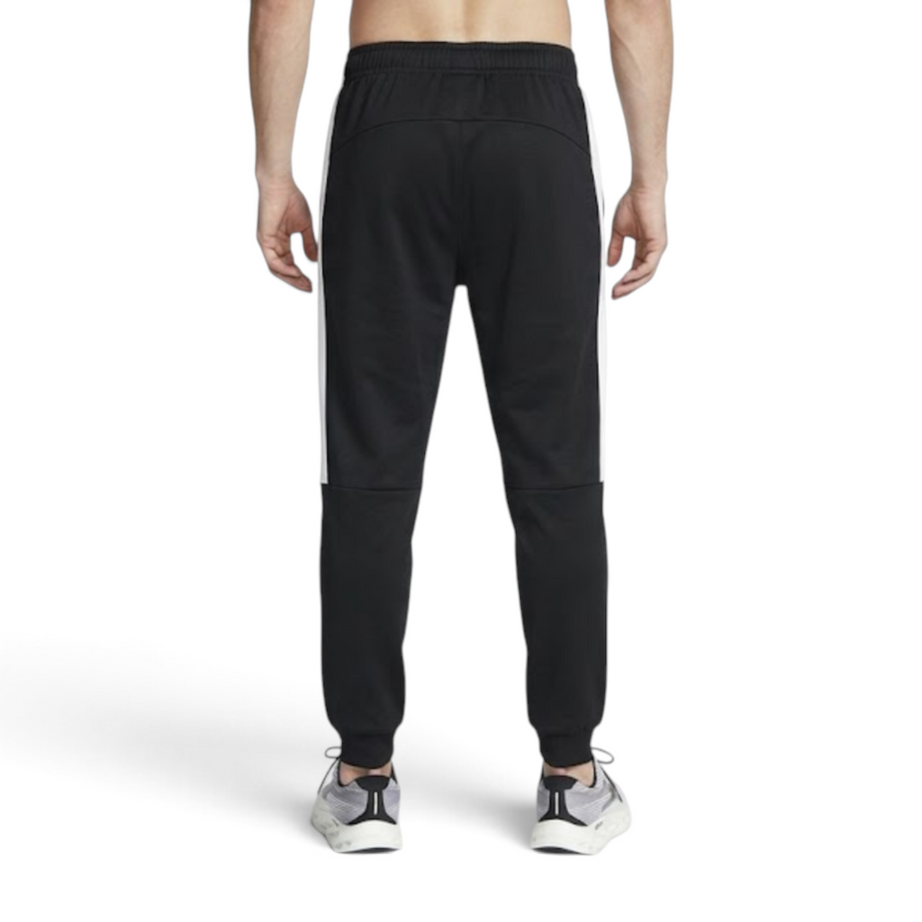 FRG ANTA black and white woven track pants on a person from the back view showing athletic fit and cuffed ankles