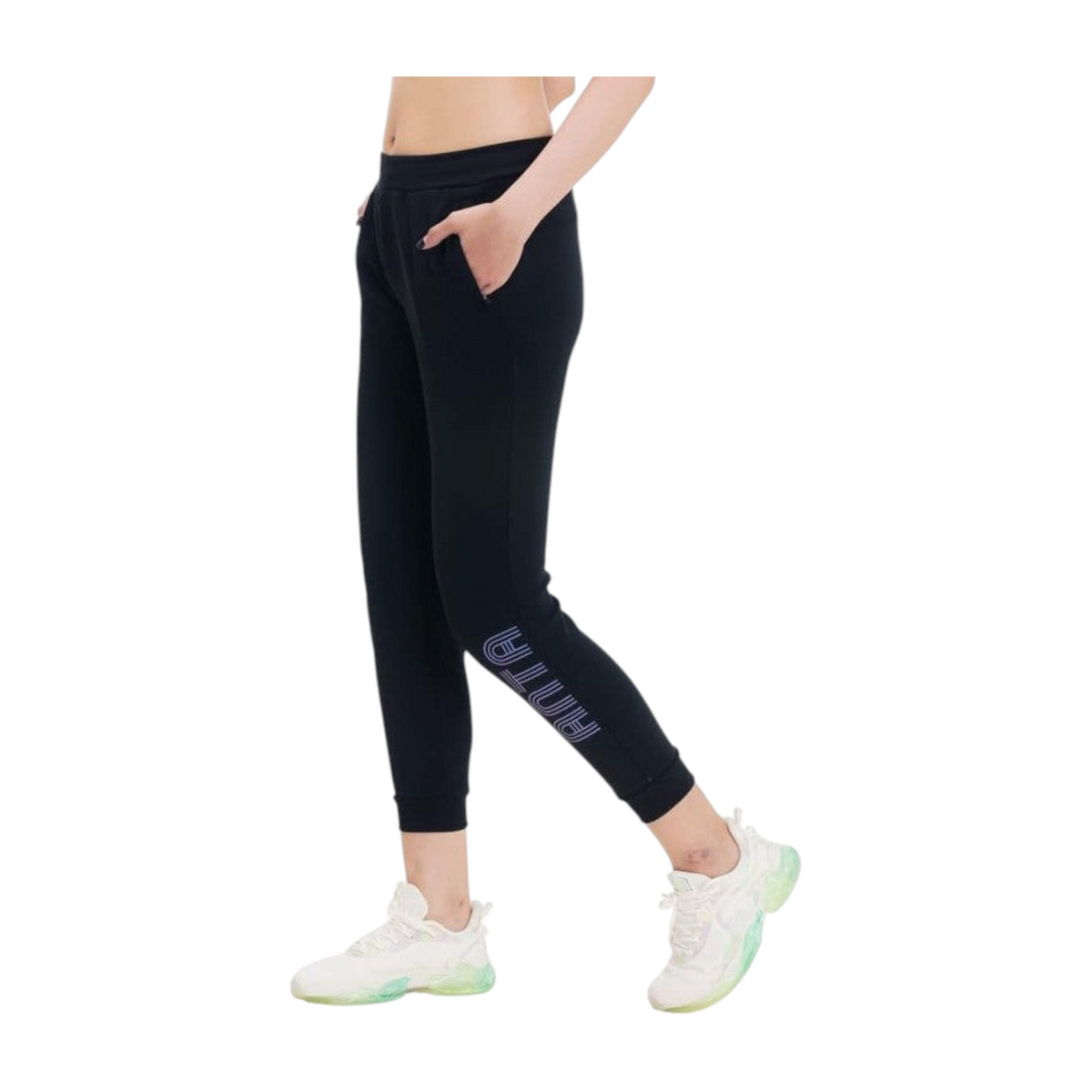 FRG ANTA black knit ankle training pants with four-way stretch and side logo on a model wearing white sneakers
