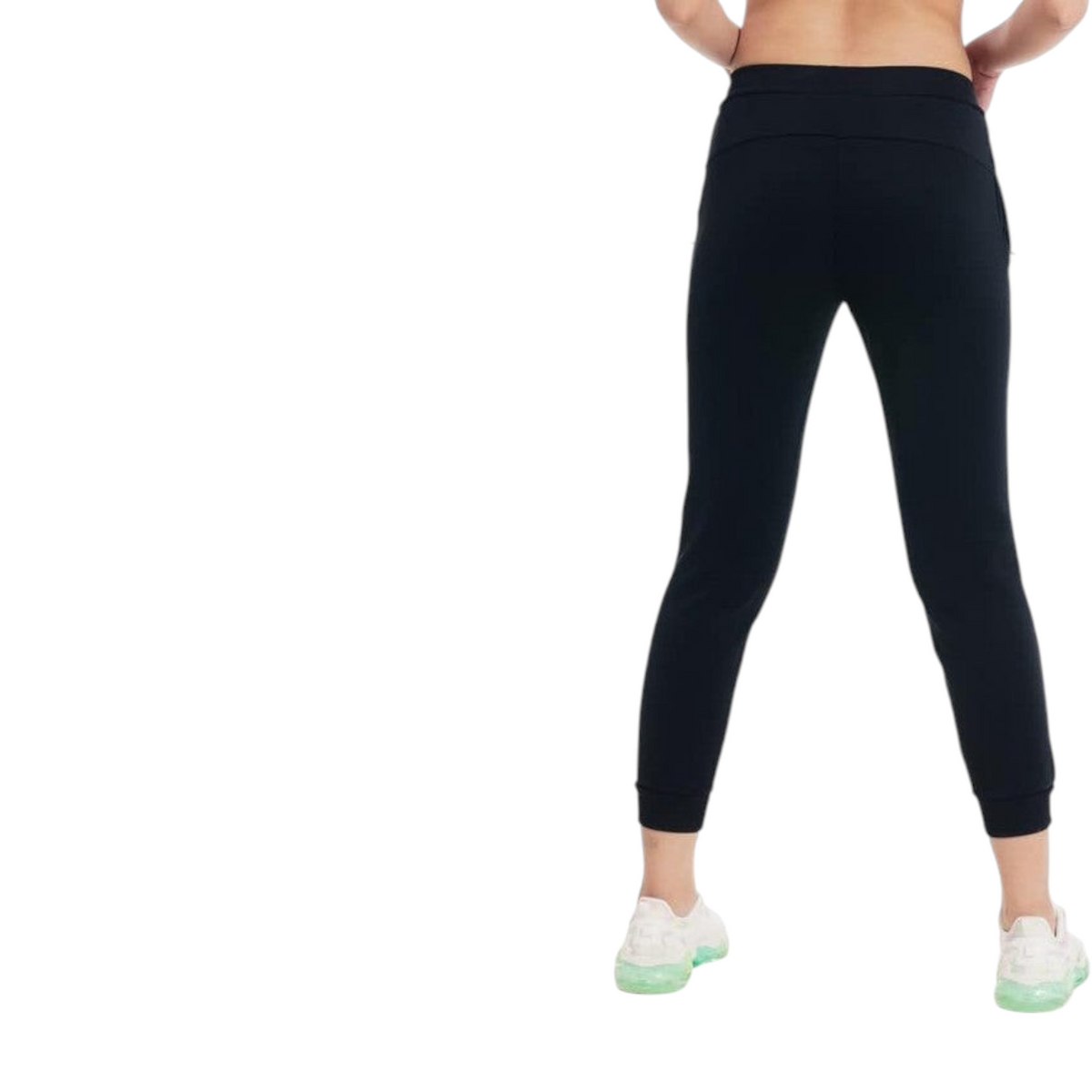 FRG ANTA black knit ankle training pants with four-way stretch fabric, viewed from the back on a model.