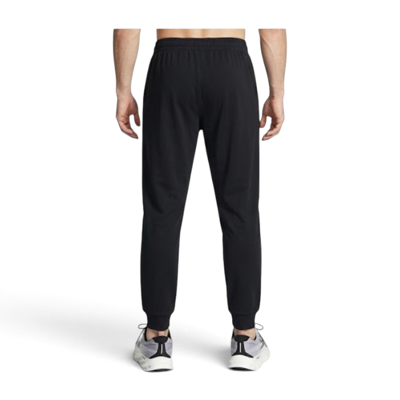 FRG ANTA black knit track pants with a comfortable fit and ribbed cuffs viewed from the back on a male model