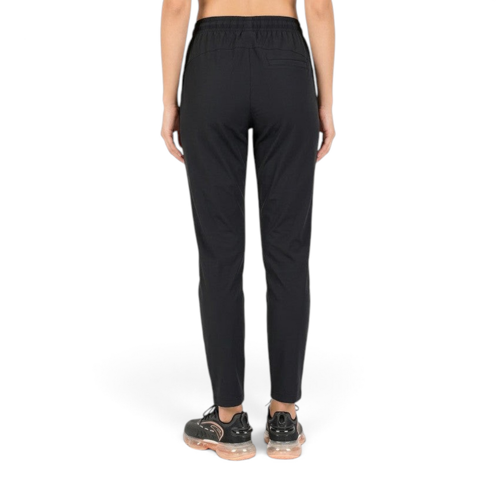 FRG ANTA black knit ankle pants featuring a flexible nylon-spandex blend, shown from the back on a model.