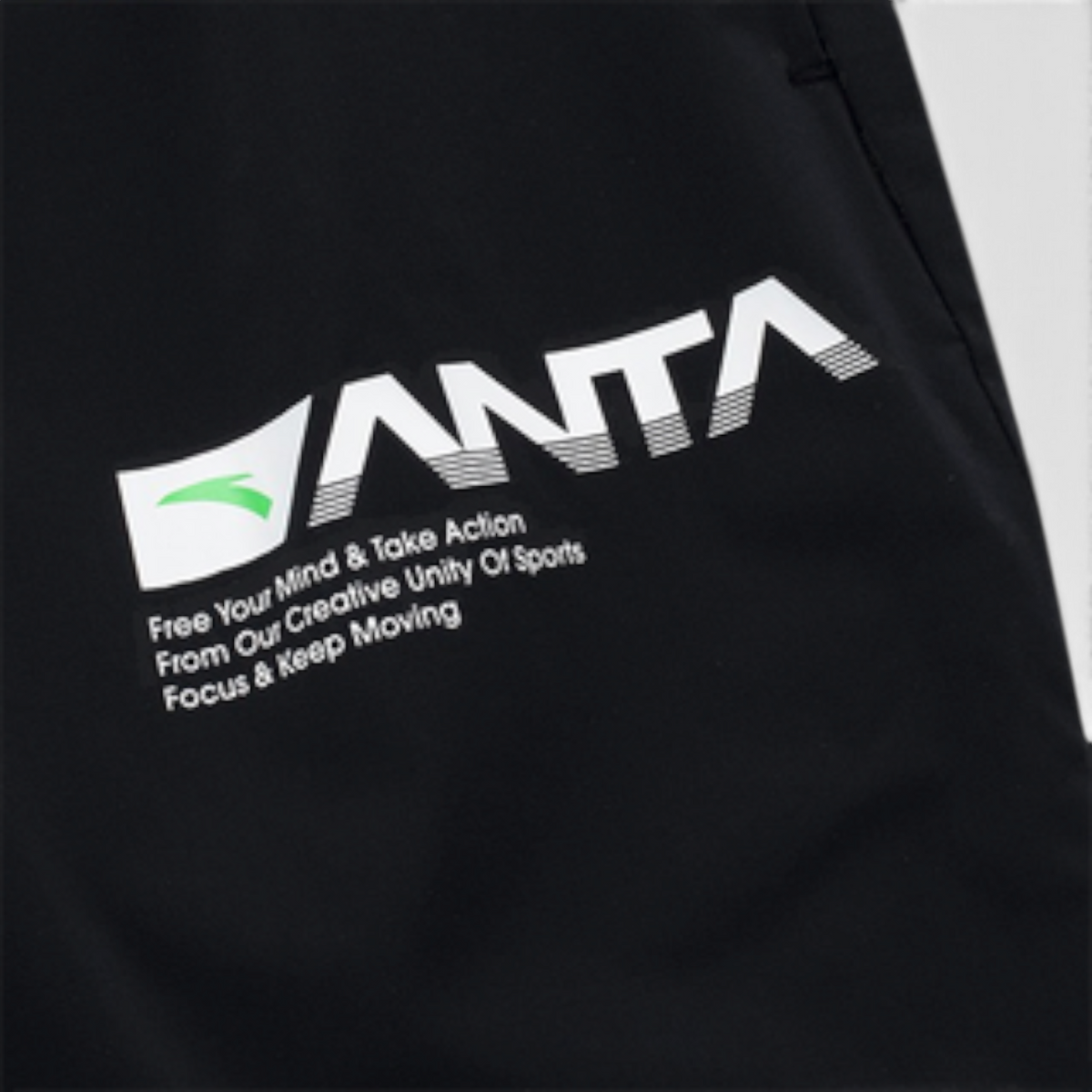 FRG ANTA black woven track pants featuring a white graphic logo and inspirational text detail
