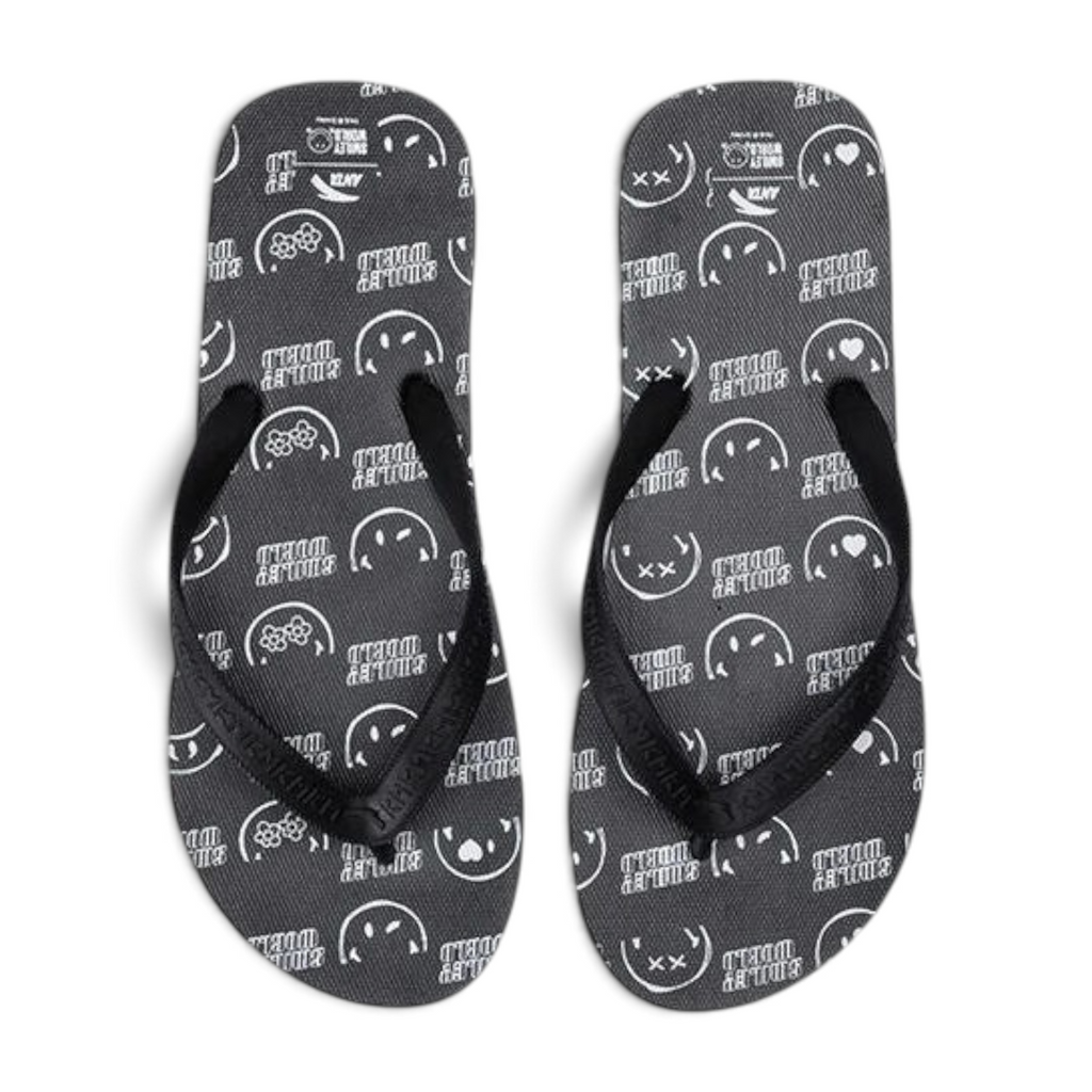 FRG beach slippers in black featuring a white Smiley World pattern and comfortable rubber thong straps