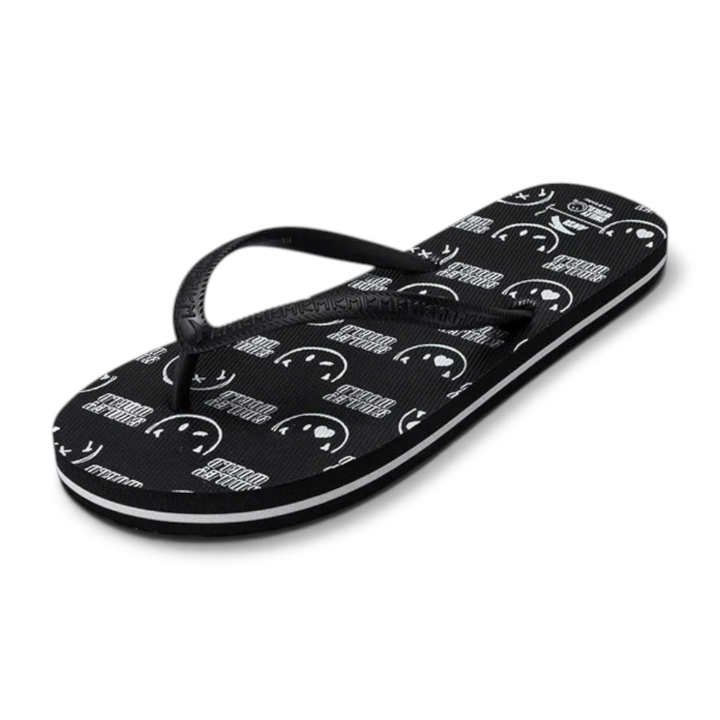 FRG beach slippers in black featuring a white smiley face pattern and striped sole detail
