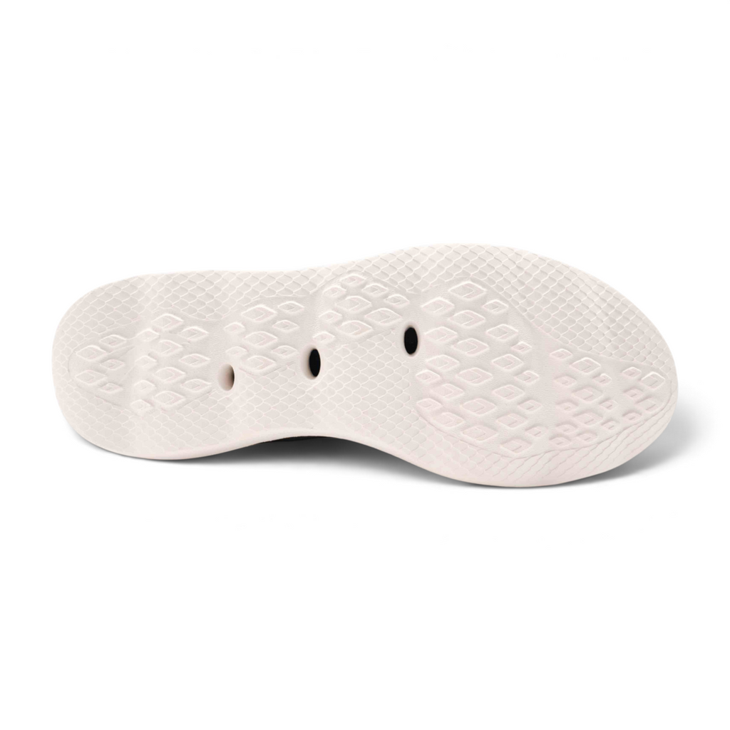 FRG outdoor shoes featuring a white textured rubber sole with drainage holes for water performance