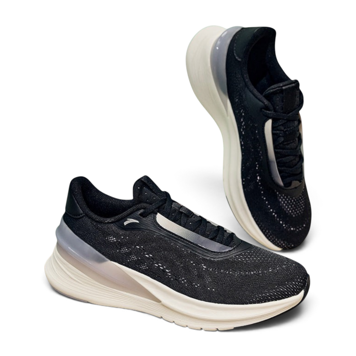 FRG running shoes featuring a black breathable mesh upper and a thick white cushioned sole with grey heel support