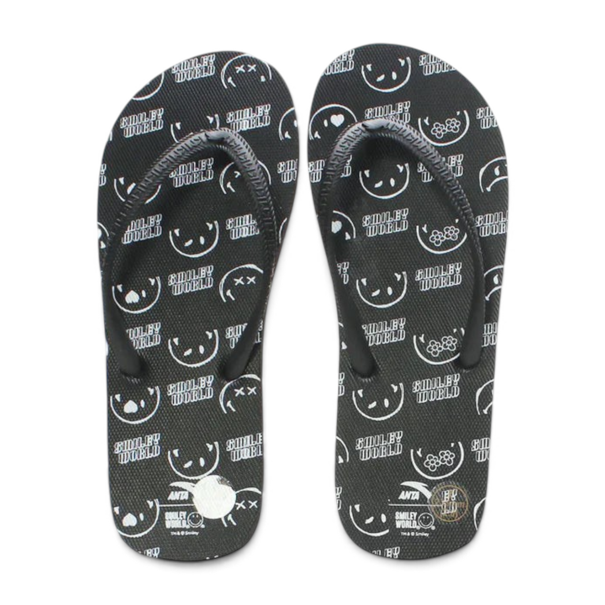 FRG beach slippers in black featuring a white Smiley World pattern with various expressive faces and floral icons