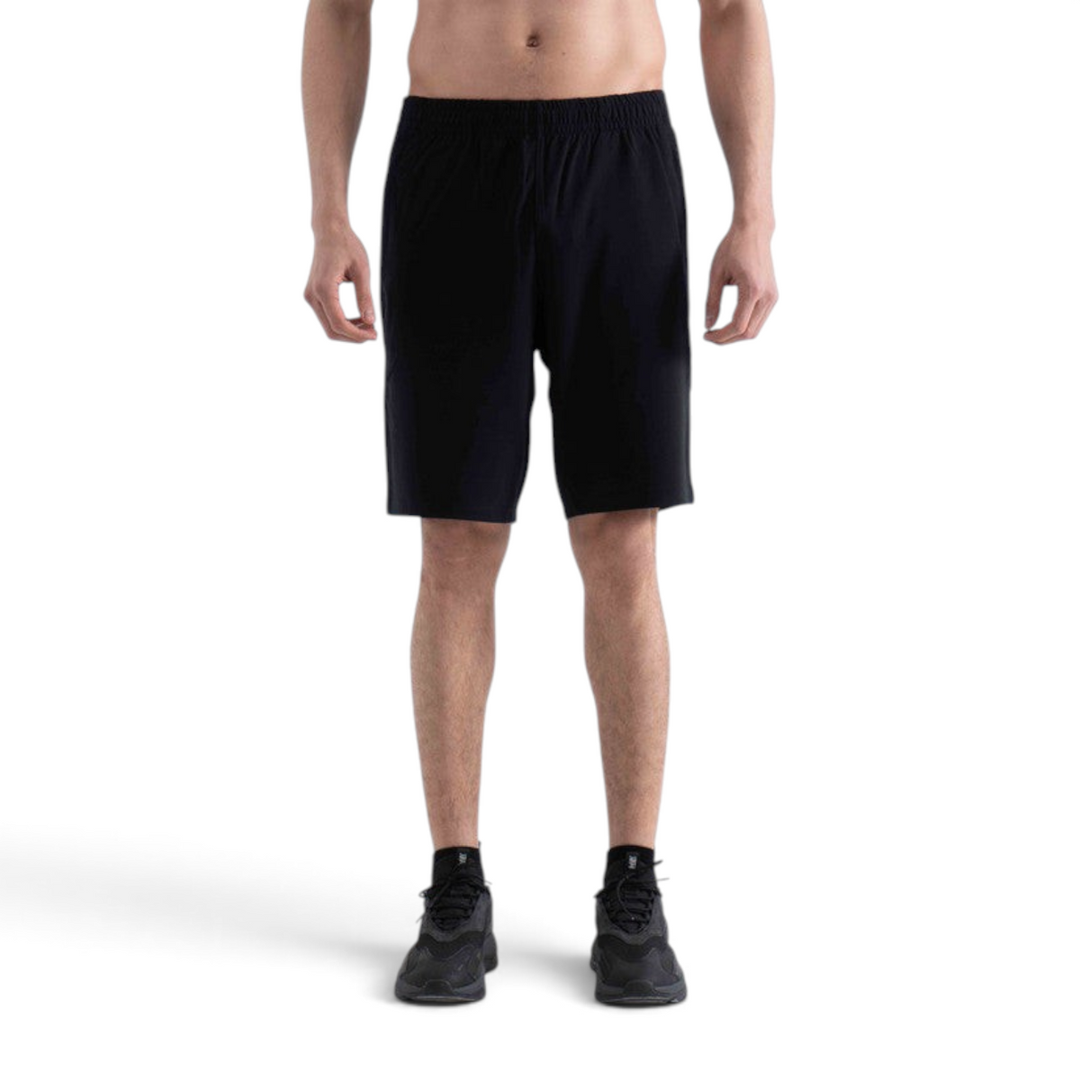 FRG knit half pants in black worn by a man, featuring an elastic waistband and a comfortable athletic fit.