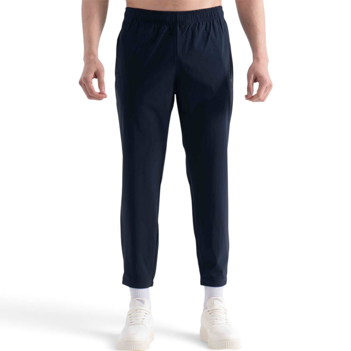 FRG navy blue knit ankle pants with an elastic waistband worn by a man with white sneakers
