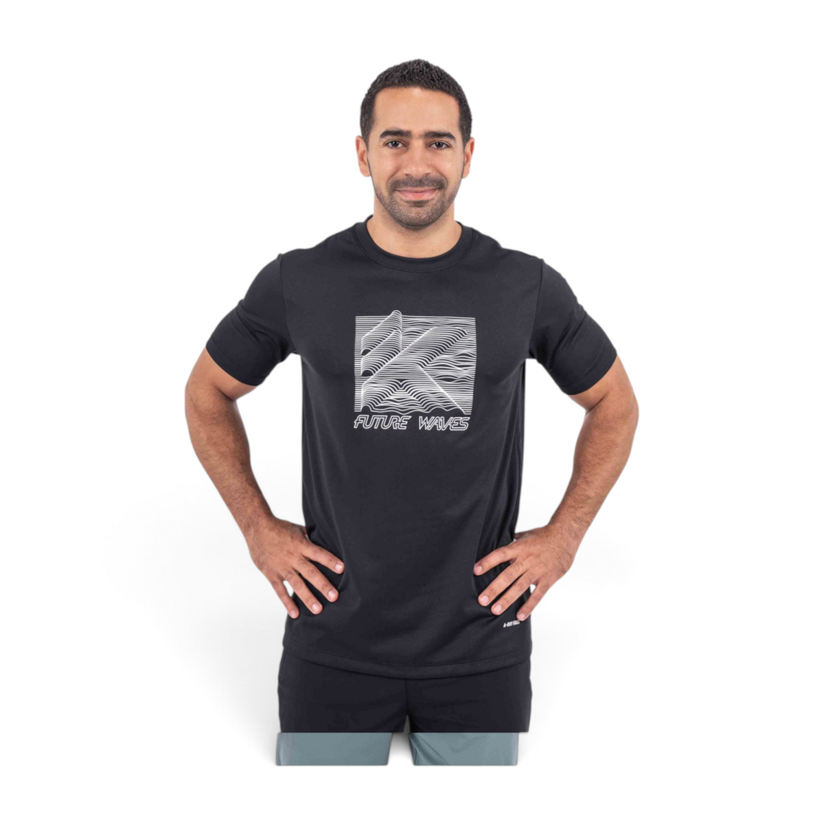 Man wearing a black FRG T-shirt with a white Future Waves graphic print on the chest, isolated on white background