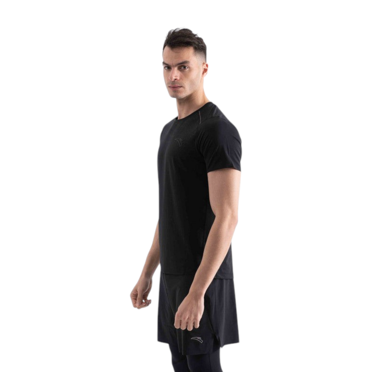 A man wearing a black FRG short-sleeve athletic t-shirt and matching shorts, side profile view.