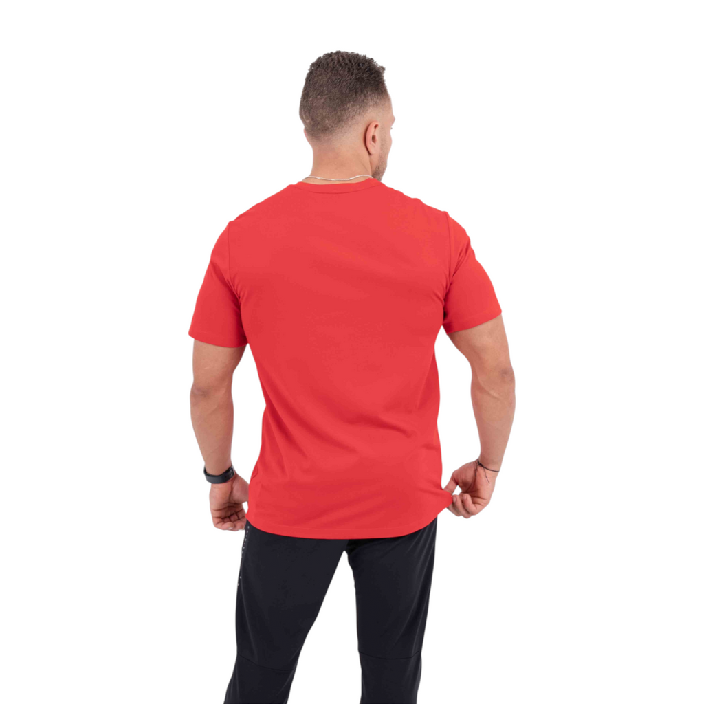 Back view of a man wearing a plain red FRG cross training t-shirt with black athletic pants against a white background