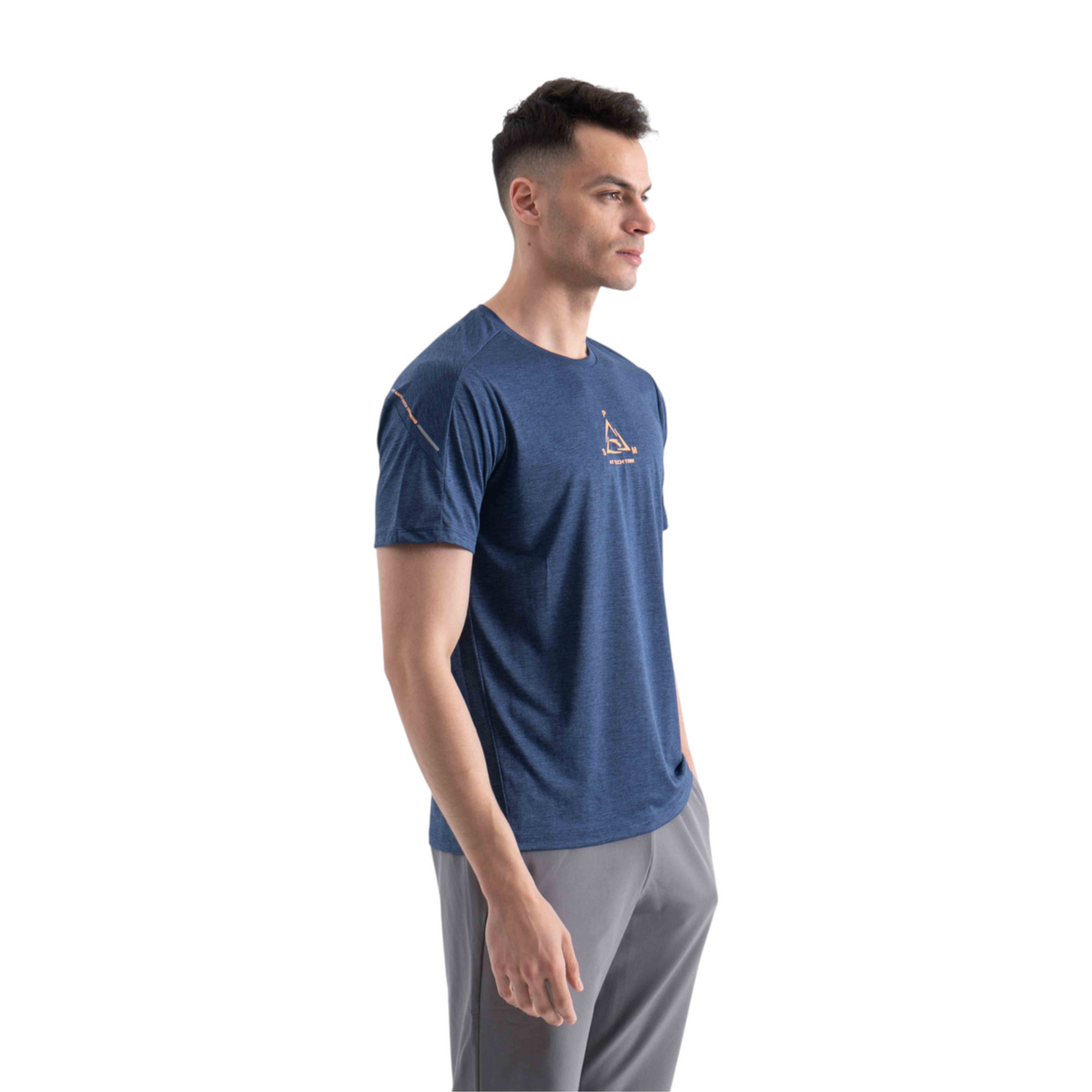 FRG blue cross training t-shirt with orange logo detail worn by a man against a white background