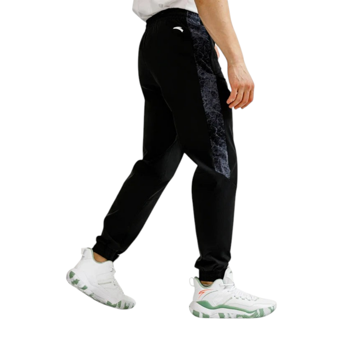 FRG Anta basketball pants in black with grey marble-patterned side panels and elastic cuffs on a male model