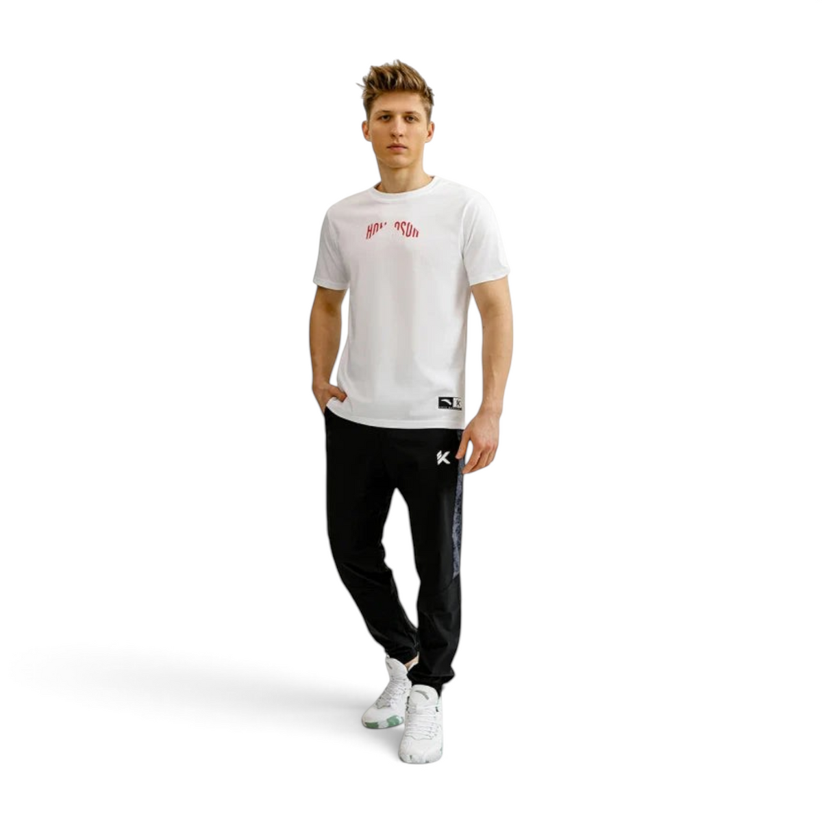 FRG Anta relaxed-fit black basketball pants with water-resistant coating worn by a man in a white t-shirt