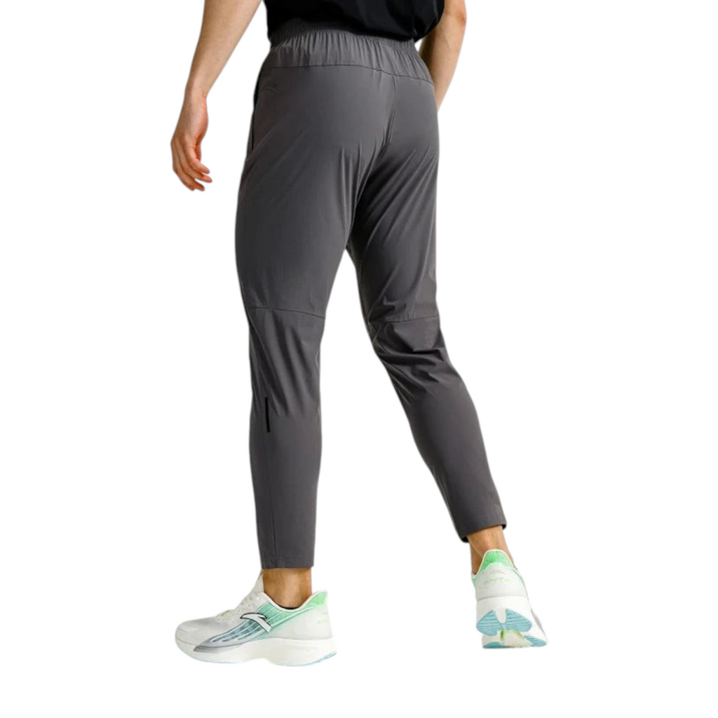 FRG ANTA grey cropped textile running trousers with reflective details and UV protection worn by a male runner