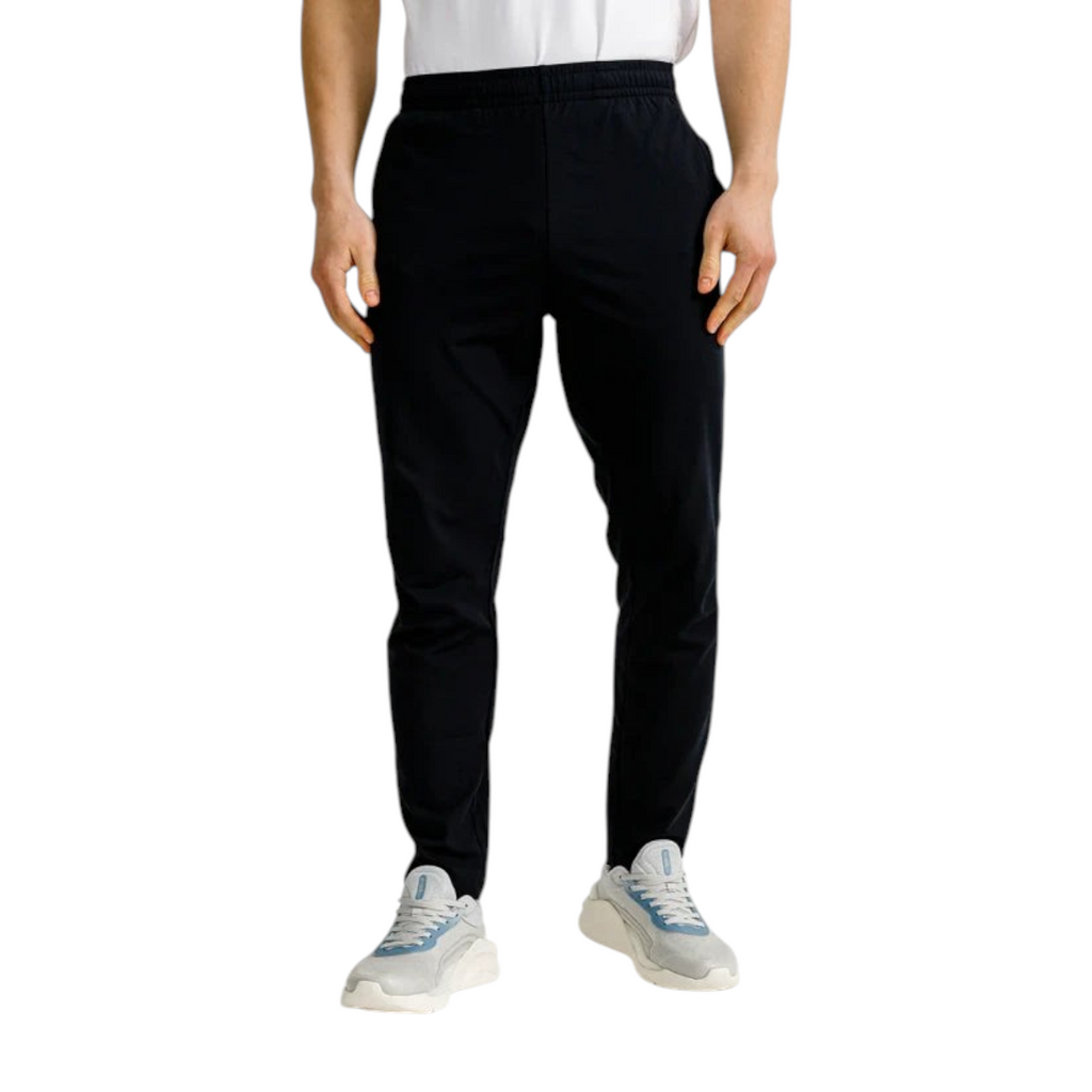 FRG Anta slim-fit black training trousers in Ecocozy fabric with wide elastic waist worn by a male model