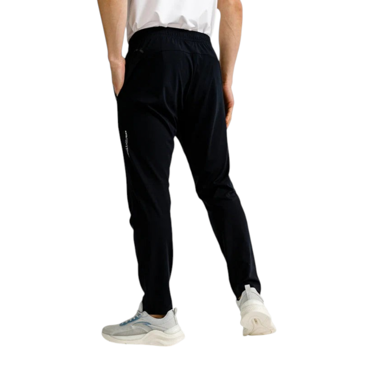 FRG Anta Training slim-fit black knit trousers with elastic waist and cooling fabric, back view on a male model