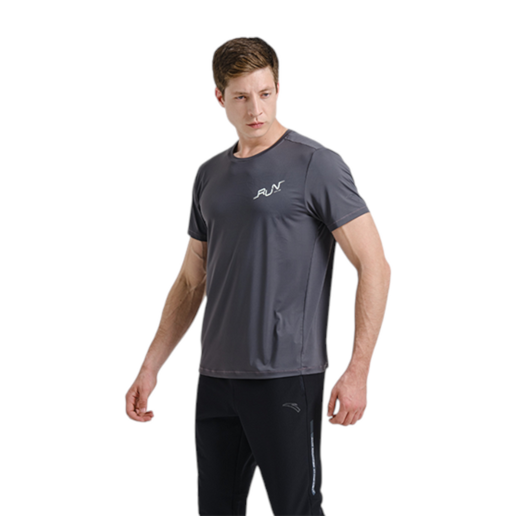 FRG men wearing a dark grey Anta short sleeve running tee with UV protection and cooling technology