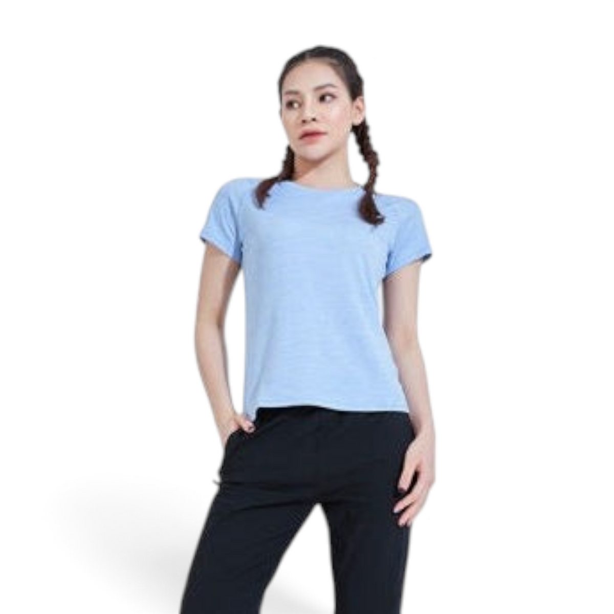 A woman wearing a light blue FRG crew neck t-shirt with short sleeves, paired with black athletic pants.
