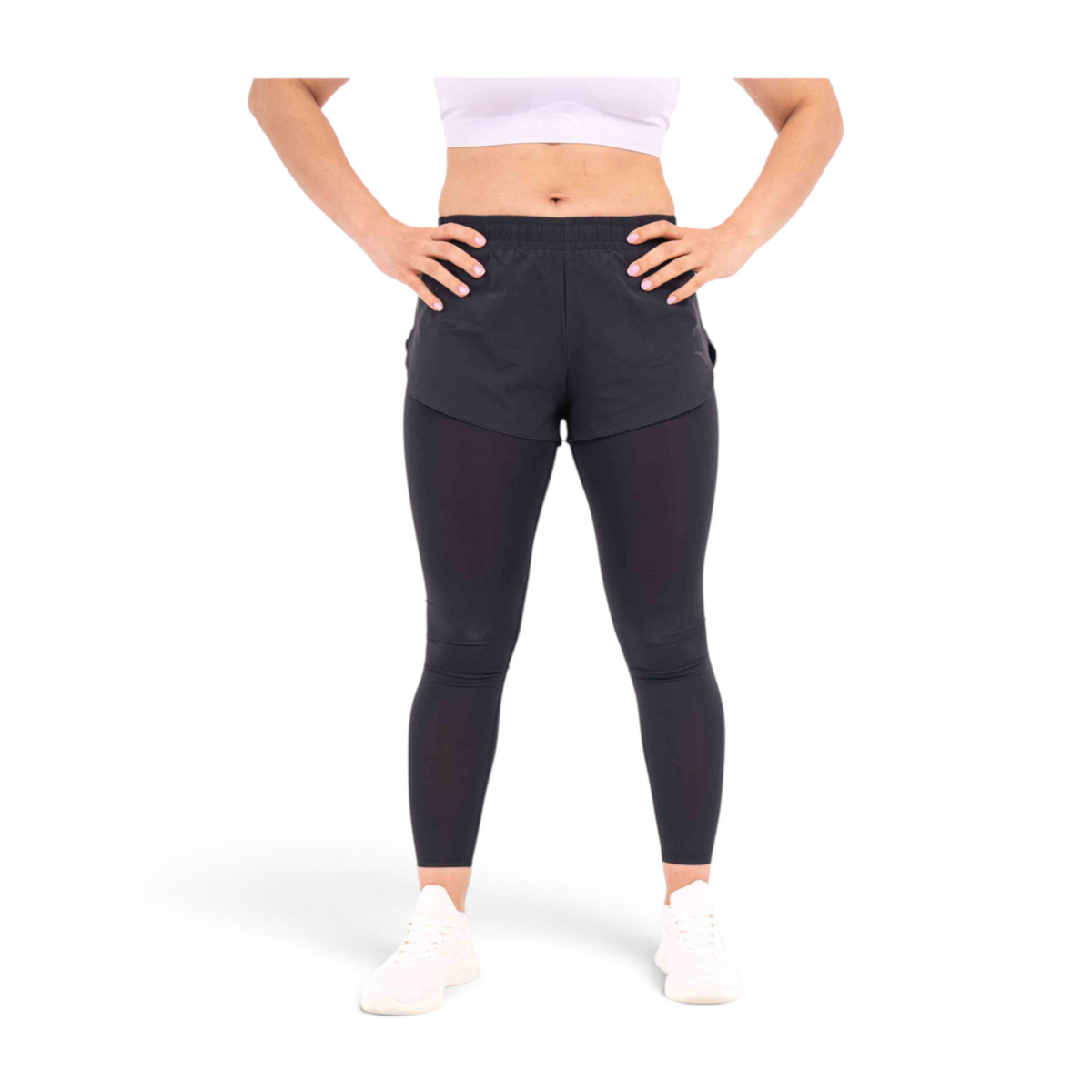 FRG black polyester tight pants with an integrated short layer, worn by a model with hands on hips