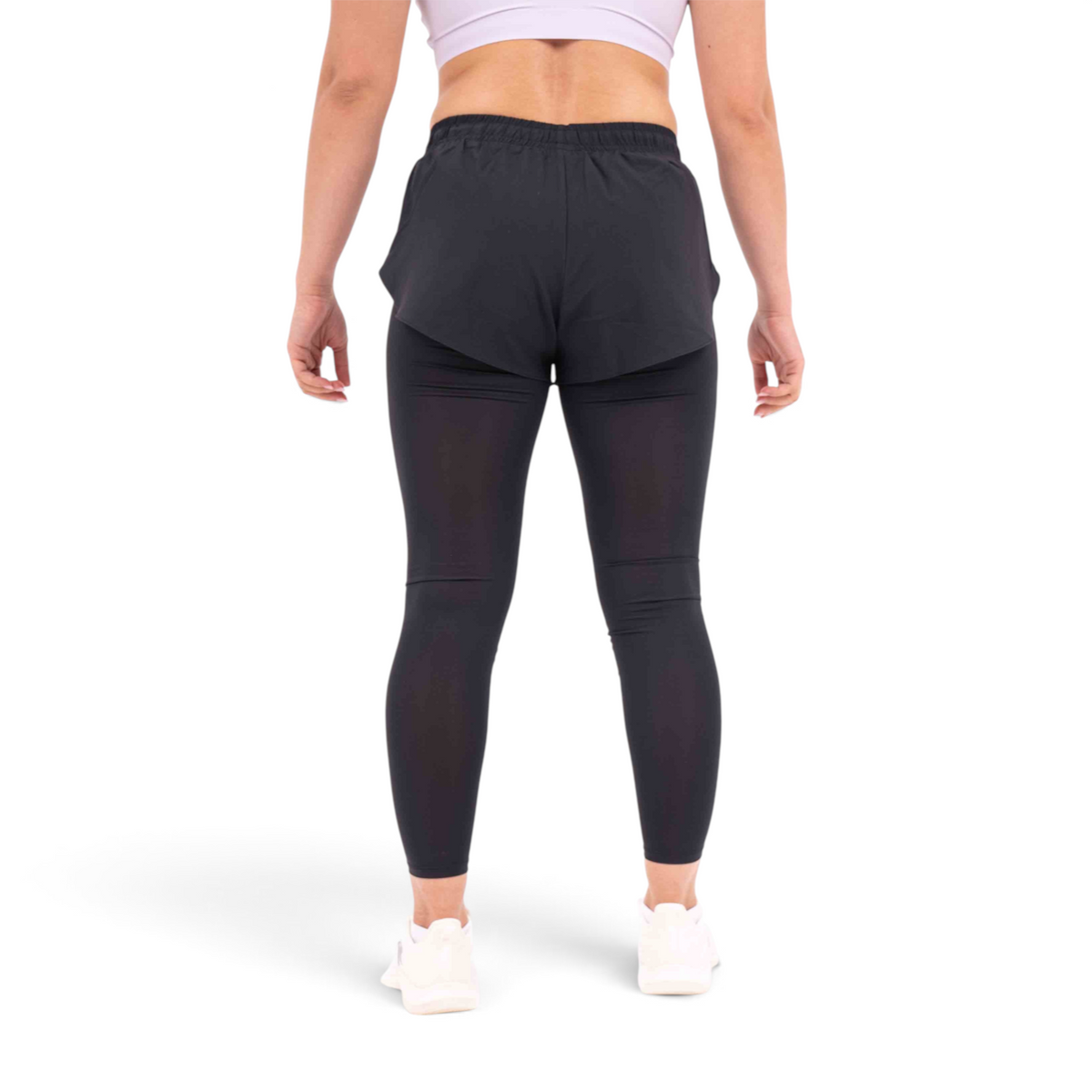FRG regular fit black polyester tight pants worn by a woman from the back view
