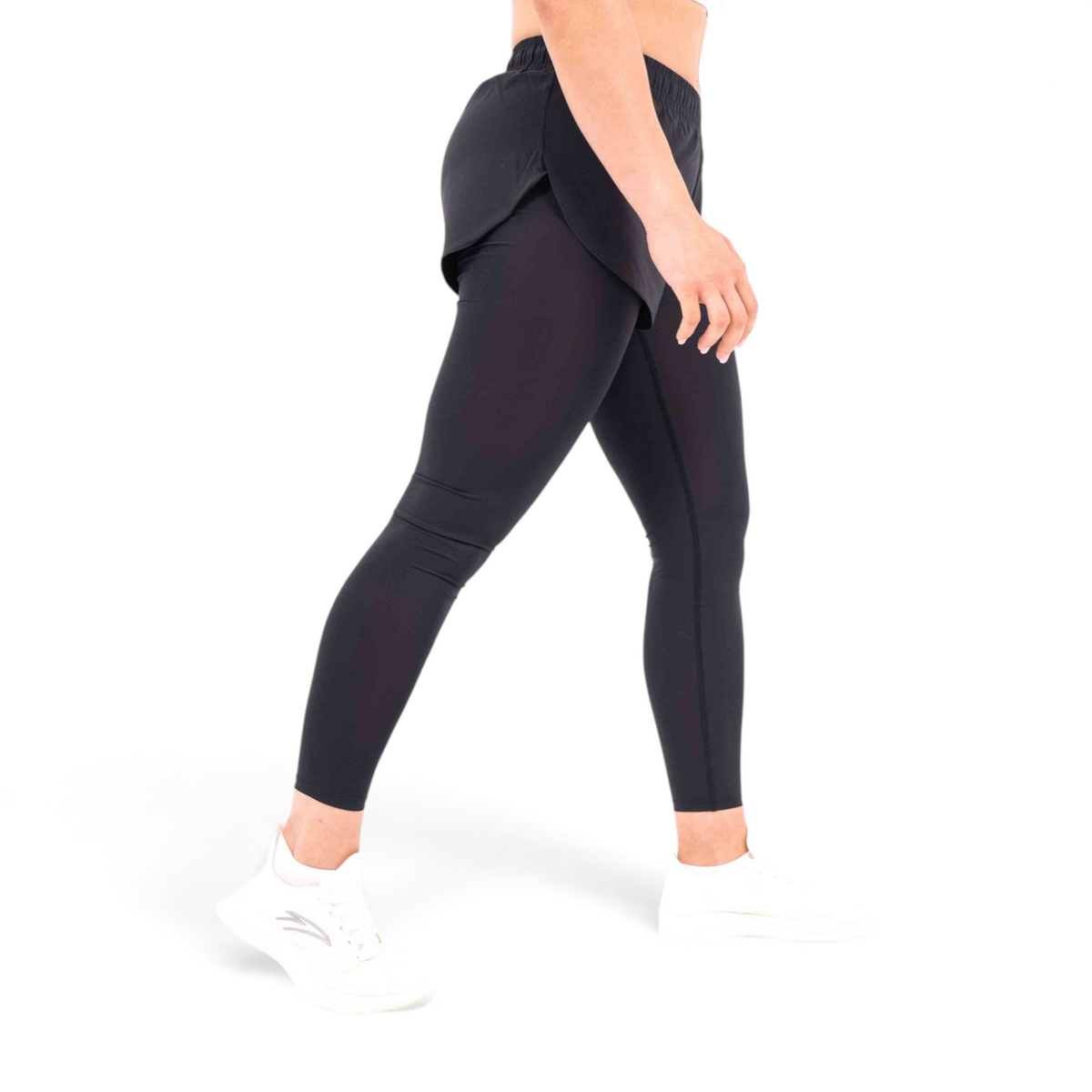 FRG black regular fit polyester tight pants with integrated shorts, side view on a model wearing white sneakers