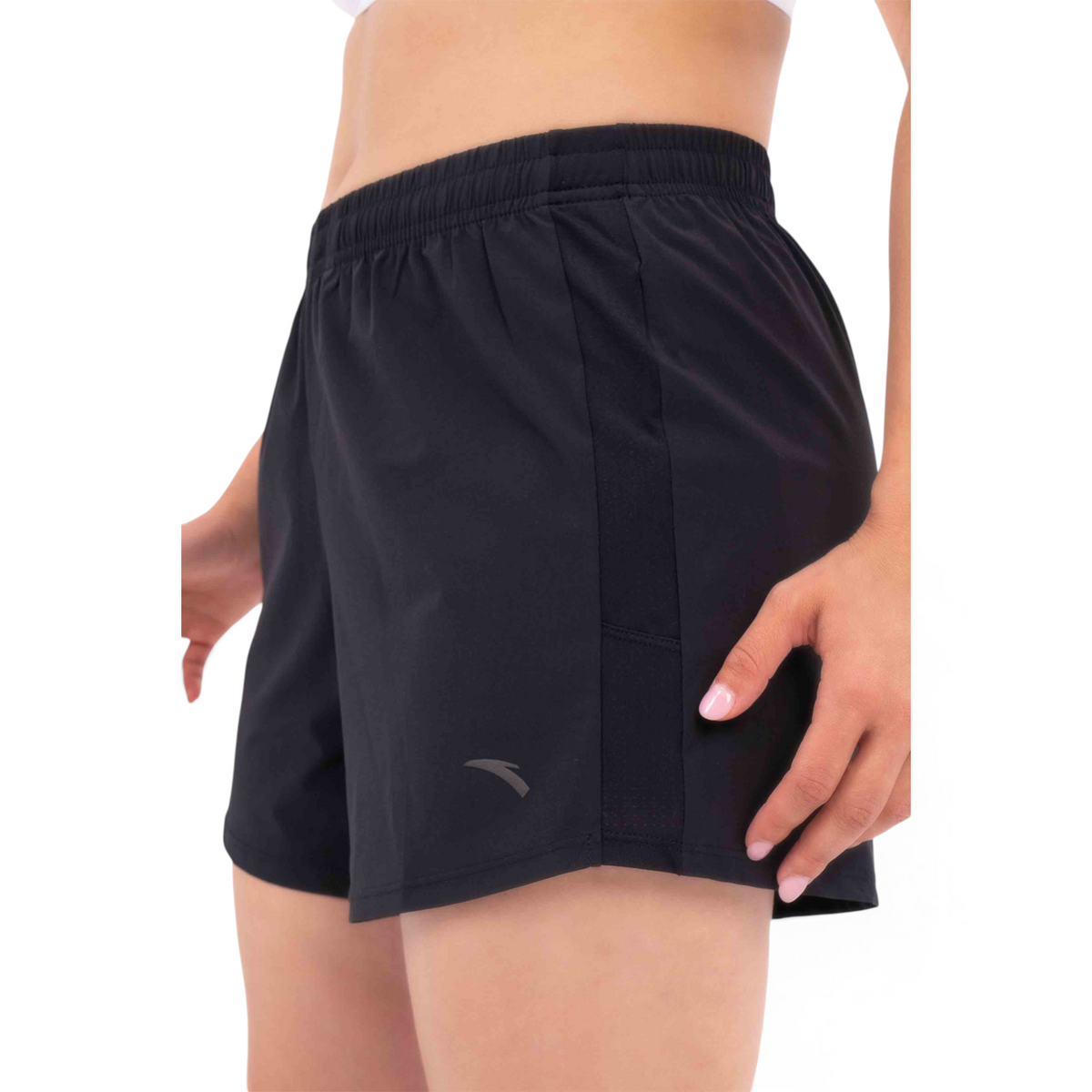 FRG black athletic shorts with an elastic waistband and side mesh panel detail worn by a woman