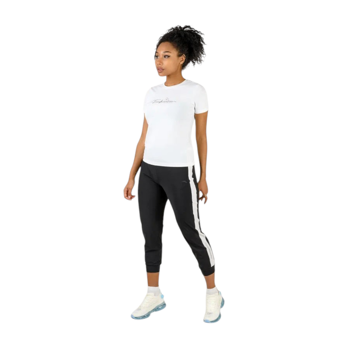 FRG model wearing a white ANTA cross training short sleeve t-shirt with black athletic joggers and white sneakers.