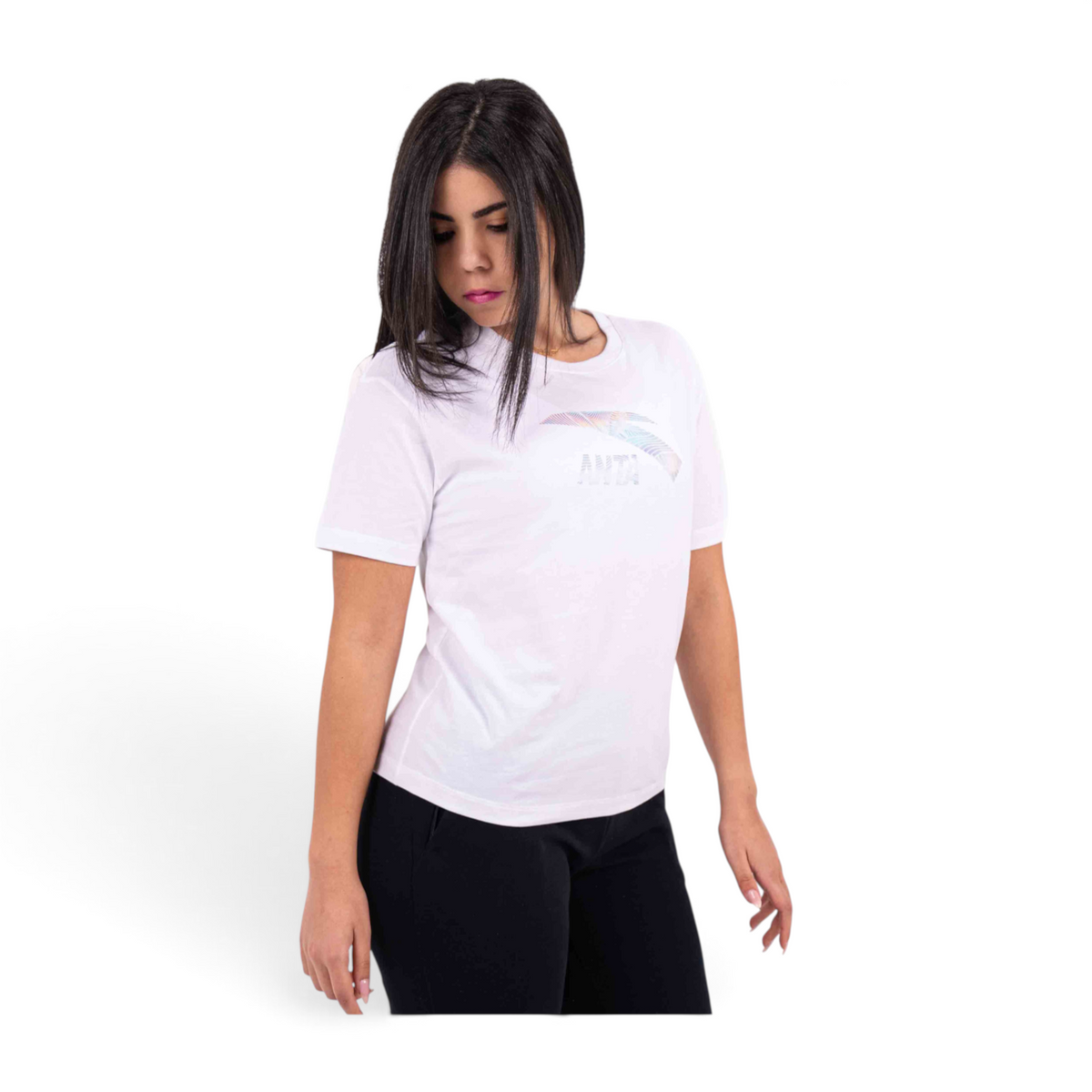 Woman wearing a white FRG T-shirt with a holographic logo graphic on the chest against a plain white background