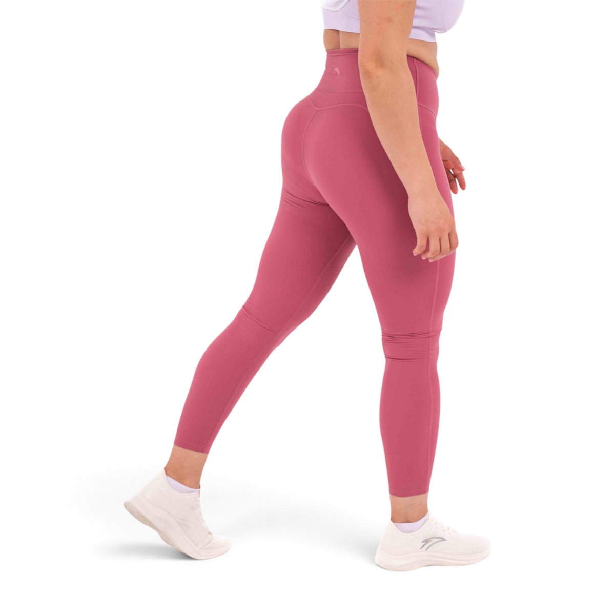 FRG slim fit ankle pants in dusty rose, made from polyamide and spandex, shown from a side profile on a model.