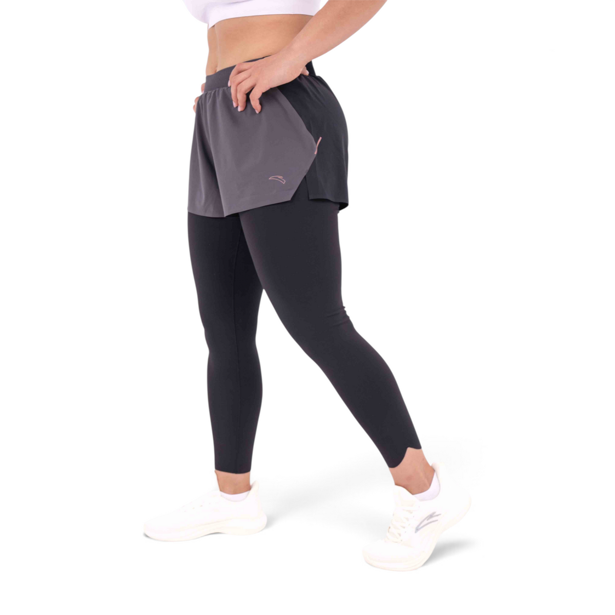 FRG slim fit track pants featuring black leggings layered under grey athletic shorts made from polyester and spandex