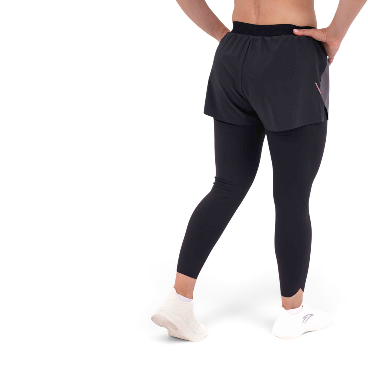 FRG slim fit black track pants with integrated shorts and leggings, worn by a model from the back view.
