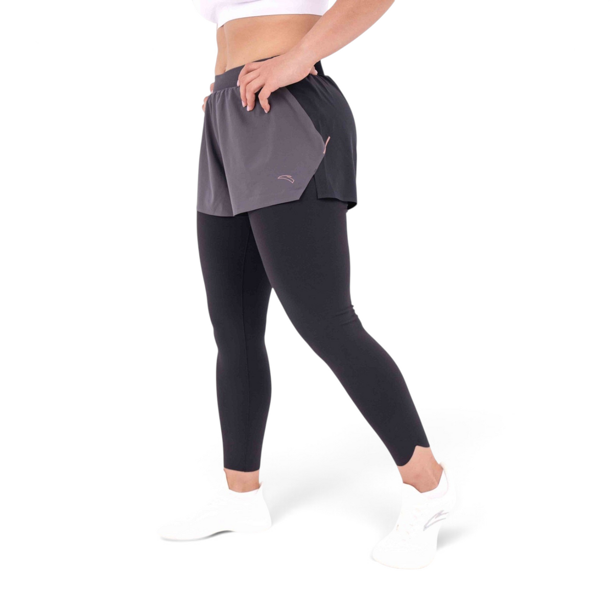FRG slim fit black and grey polyester spandex track pants with built-in shorts and leggings on a model