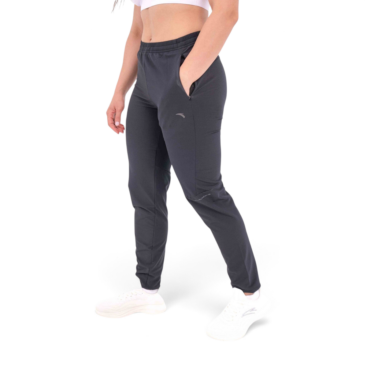 FRG slim fit black woven track pants made from polyester and spandex blend with zippered side pockets